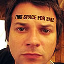 Cunning forehead-advertising promotional image reading This space for sale.