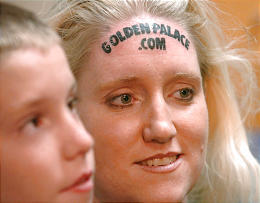 Kari Smith and her son Brady after the GoldenPalace forehead tattoo, June 2005.