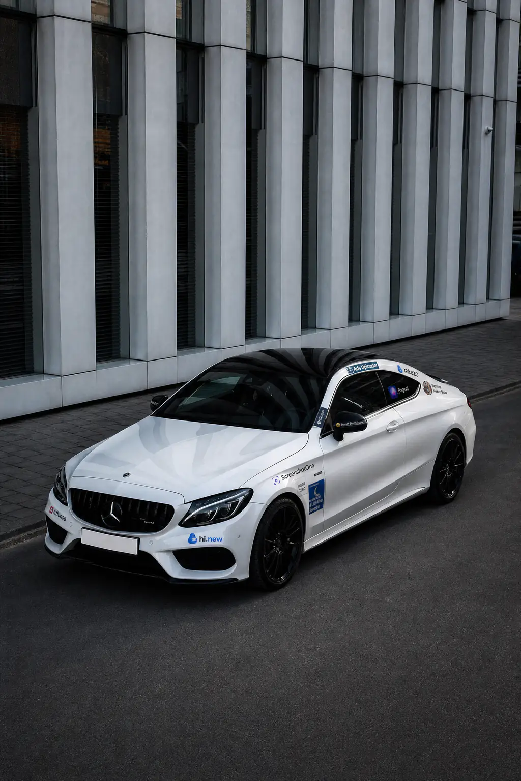 White Mercedes-AMG with sponsor logos on Damian’s campaign website.